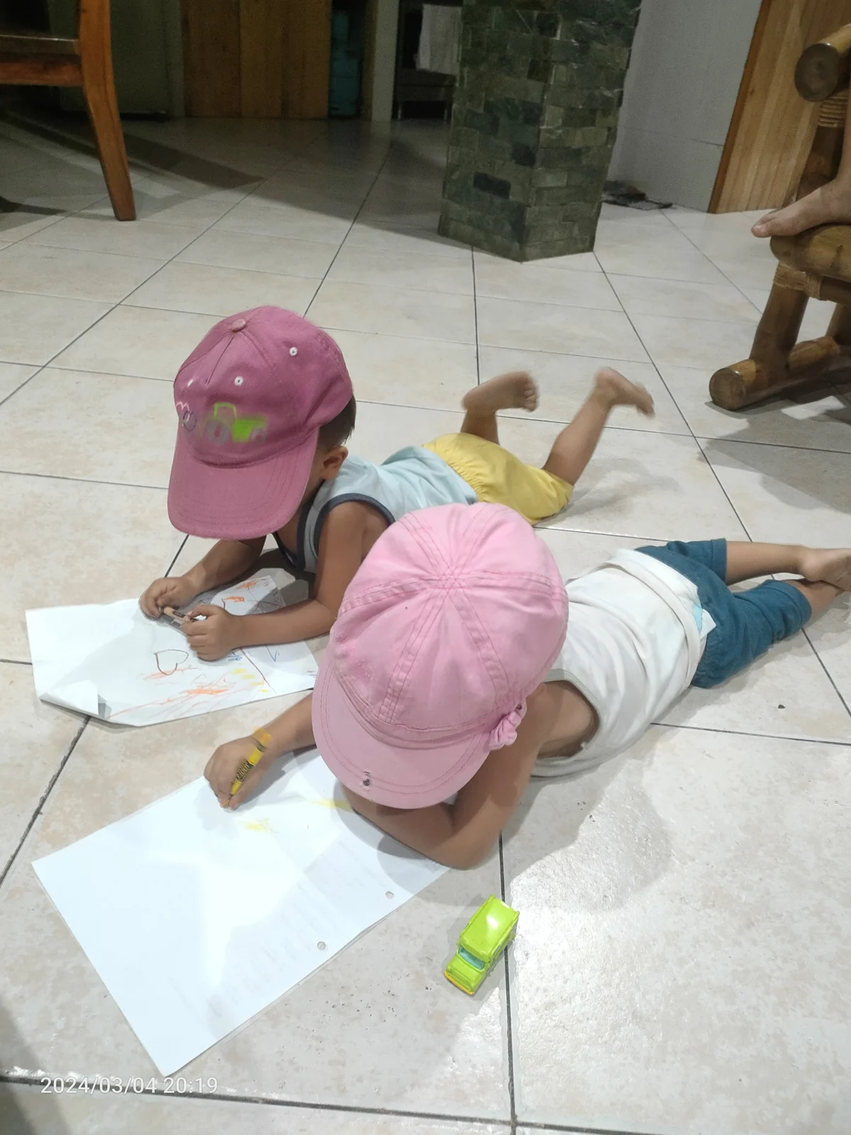 Children drawing together at Nipa House